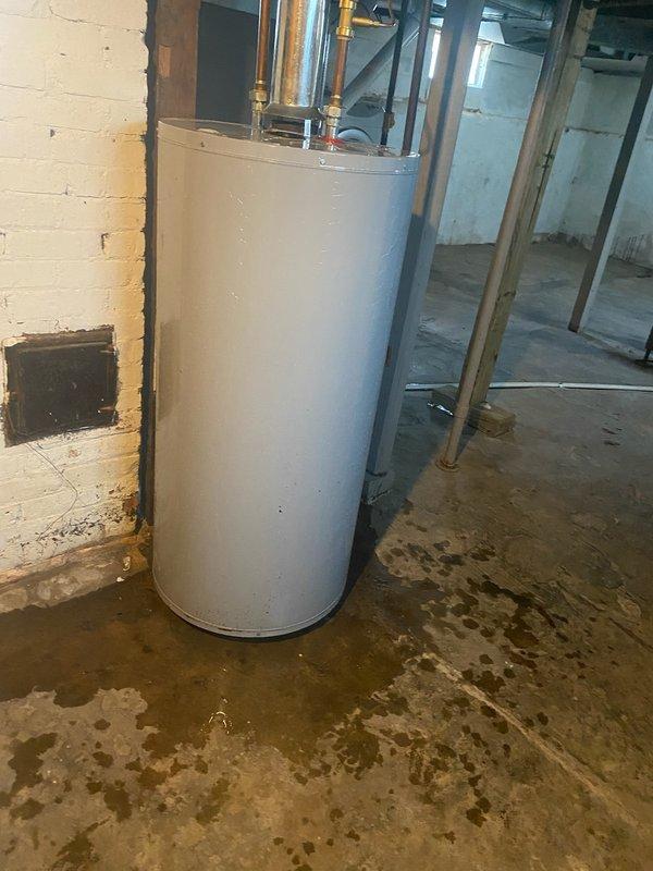 Completed installation of 70,000 BTU furnace with humidifier and 2.5-ton air conditioning system with left-side configuration and reconnection of existing components. Mechanical permit obtained for furnace-only installation. Identified water heater leaking upon water activation and noted significant water damage on concrete floor in utility area, with recall scheduled for drain removal and replacement with condensate pump system.