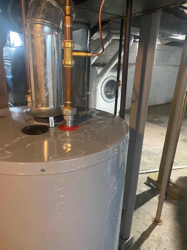 Completed installation of 70,000 BTU furnace with humidifier and 2.5-ton air conditioning system with left-side configuration and reconnection of existing components. Mechanical permit obtained for furnace-only installation. Identified water heater leaking upon water activation and noted significant water damage on concrete floor in utility area, with recall scheduled for drain removal and replacement with condensate pump system.