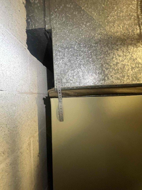 Conducted on-site evaluation for cooling system replacement of approximately 20-year-old Bryant air conditioning unit. Documented existing HVAC infrastructure including ductwork configuration, mounting hardware, and clearance measurements in mechanical room. Provided replacement system estimate for installation scheduled in upcoming year.