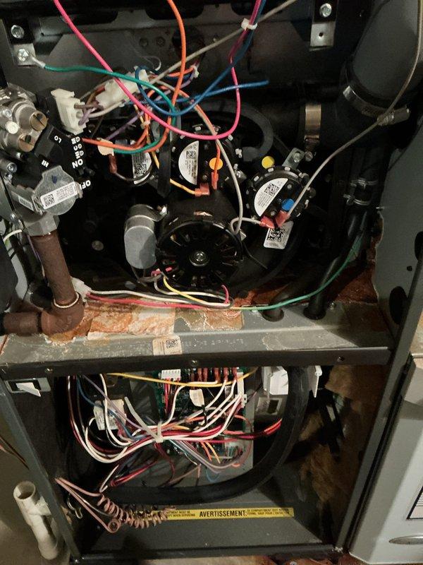 Performed AHC maintenance inspection on air handler unit. Upon access, discovered significant rust and corrosion on interior metal components, drip pan, and separation panels indicating long-term moisture intrusion and condensation issues. Documented existing conditions with photographic evidence showing deterioration of metal surfaces, though blower motor assembly, control board, and electrical connections appeared functional at time of inspection.