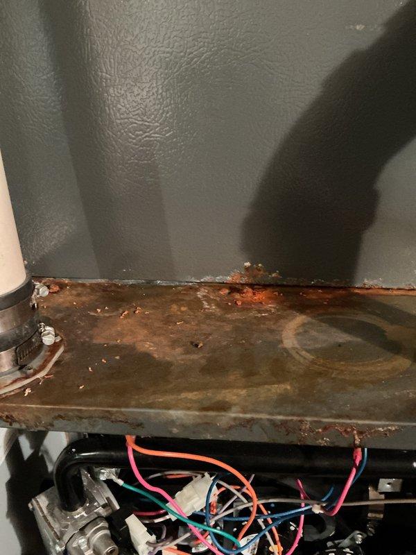 Performed AHC maintenance inspection on air handler unit. Upon access, discovered significant rust and corrosion on interior metal components, drip pan, and separation panels indicating long-term moisture intrusion and condensation issues. Documented existing conditions with photographic evidence showing deterioration of metal surfaces, though blower motor assembly, control board, and electrical connections appeared functional at time of inspection.