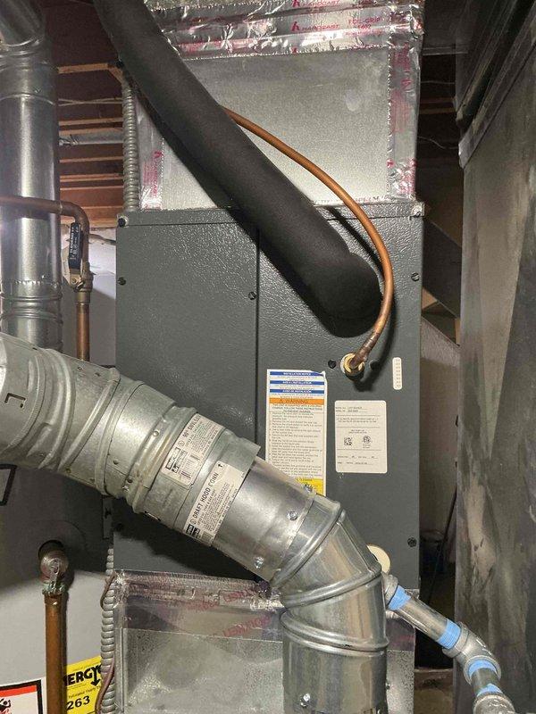 Responded to service call for reported carbon monoxide leak from Rheem furnace located in basement. Performed comprehensive safety inspection and combustion analysis of heating system. Upon thorough examination of furnace, heat exchanger, flue pipe connections, and venting system, found no evidence of active carbon monoxide leak or compromised heat exchanger integrity. Verified proper draft and venting operation, confirmed all gas connections were secure, and tested combustion efficiency parameters within acceptable ranges. Advised customer that system appeared to be operating safely at time of inspection, though age of equipment is unknown and continued monitoring is recommended.