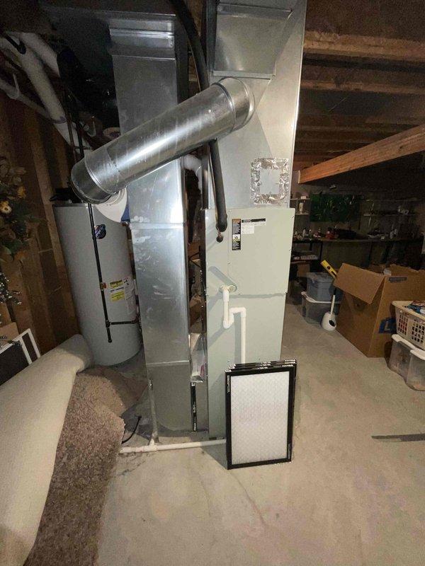 Provided comprehensive replacement estimate for 22-year-old basement HVAC system including natural gas furnace, central air conditioning unit, and water heater. Current furnace and water heater operational; air conditioning unit non-functional. Documented existing equipment configuration, ductwork layout, and installation conditions to prepare detailed replacement proposal for complete system upgrade.