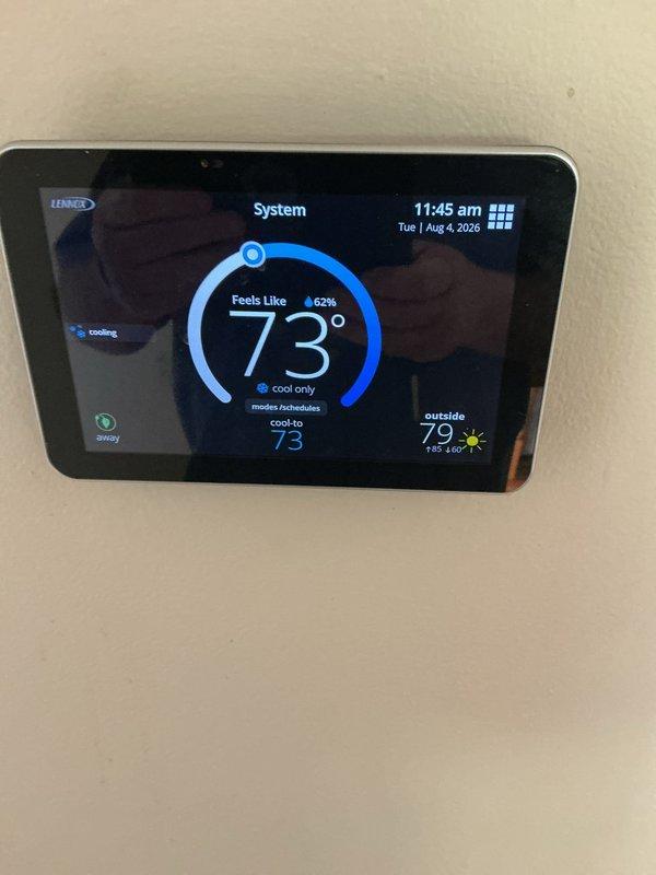 Completed comprehensive 5-year ComfortGuard Maintenance visit on residential HVAC system. Inspected and serviced Lennox furnace/air handler unit with associated ductwork, refrigerant lines, and condensate drainage system. Verified Lennox digital thermostat operation showing proper cooling function at 73°F setpoint with system maintaining comfort levels and accurate outdoor temperature readings of 79°F.
