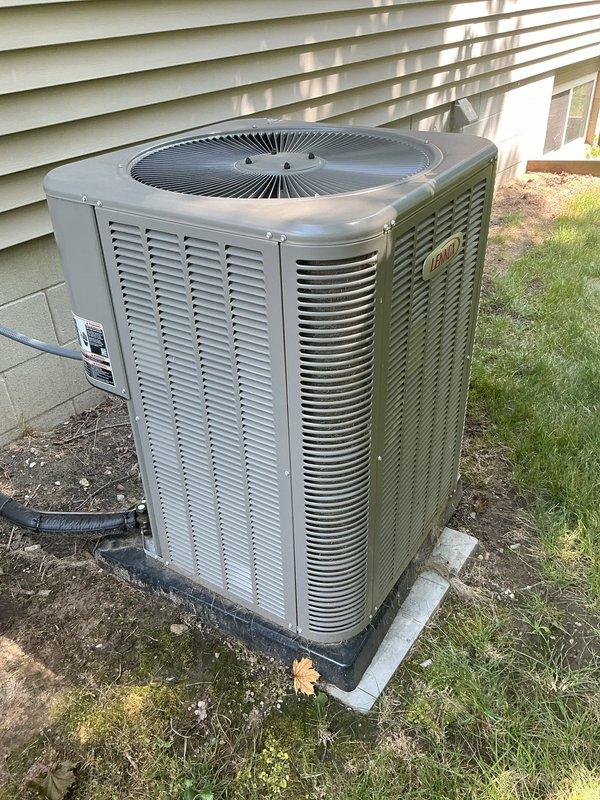 Completed complimentary one-year AC maintenance inspection on residential split system. Customer reported elevated indoor humidity levels at 55% while AC operated normally. Performed comprehensive tune-up including visual inspection of outdoor condenser unit, verified proper clearances and airflow around equipment, checked electrical connections and disconnect, inspected coil condition through louvers, and documented unit condition with photos. System found operating within normal parameters; advised customer that AC systems primarily remove humidity as a byproduct of cooling and may require additional dehumidification solutions if humidity remains elevated during moderate temperature conditions.