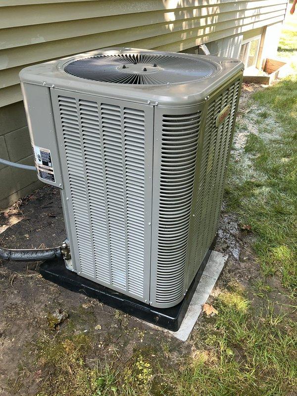 Completed complimentary one-year AC maintenance inspection on residential split system. Customer reported elevated indoor humidity levels at 55% while AC operated normally. Performed comprehensive tune-up including visual inspection of outdoor condenser unit, verified proper clearances and airflow around equipment, checked electrical connections and disconnect, inspected coil condition through louvers, and documented unit condition with photos. System found operating within normal parameters; advised customer that AC systems primarily remove humidity as a byproduct of cooling and may require additional dehumidification solutions if humidity remains elevated during moderate temperature conditions.