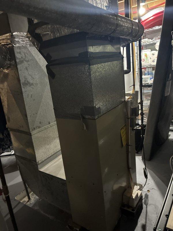Performed full system estimate for complete HVAC replacement on 16-year-old furnace and 15-year-old air conditioning system. Identified cracked heat exchanger in furnace posing carbon monoxide hazard, requiring immediate replacement to ensure safe operation. Evaluated existing AC unit nearing end of service life and recommended concurrent replacement for optimal system efficiency and compatibility. Documented current equipment conditions through photographs showing furnace installation, ductwork connections, and overall system configuration in basement utility area. Provided comprehensive replacement options with available financing solutions to address urgent safety concern while meeting budget constraints.