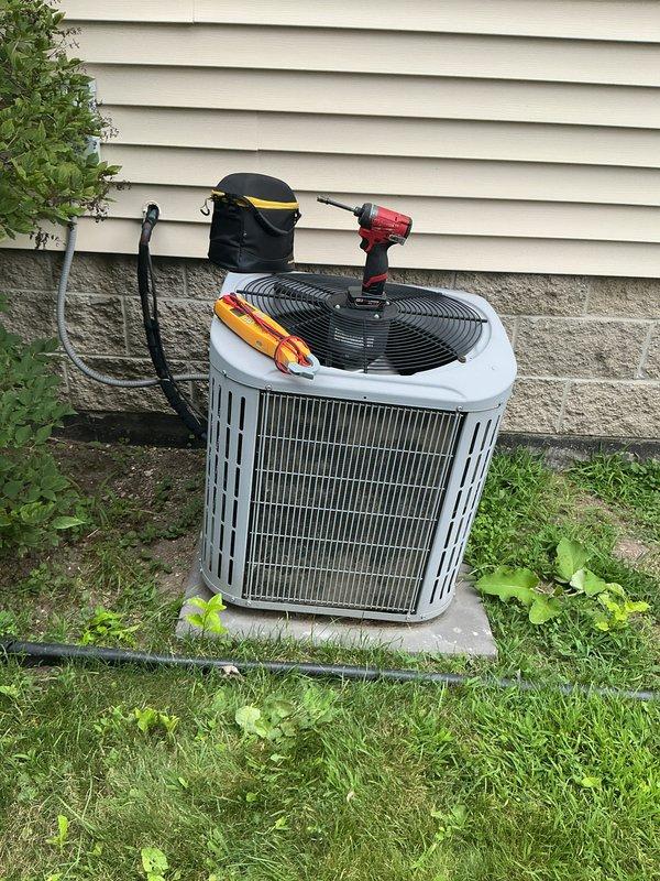 Completed comprehensive annual maintenance on 15-year-old residential air conditioning system. Performed full system inspection including electrical connections, refrigerant pressures, condenser coil cleaning, and operational testing. Unit operating within normal parameters with no deficiencies noted. All components functioning properly at time of service completion.