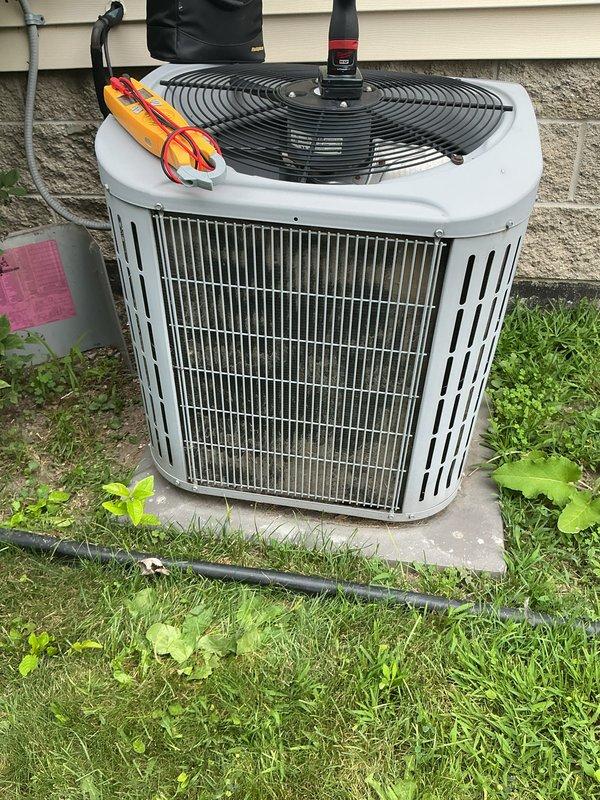 Completed comprehensive annual maintenance on 15-year-old residential air conditioning system. Performed full system inspection including electrical connections, refrigerant pressures, condenser coil cleaning, and operational testing. Unit operating within normal parameters with no deficiencies noted. All components functioning properly at time of service completion.