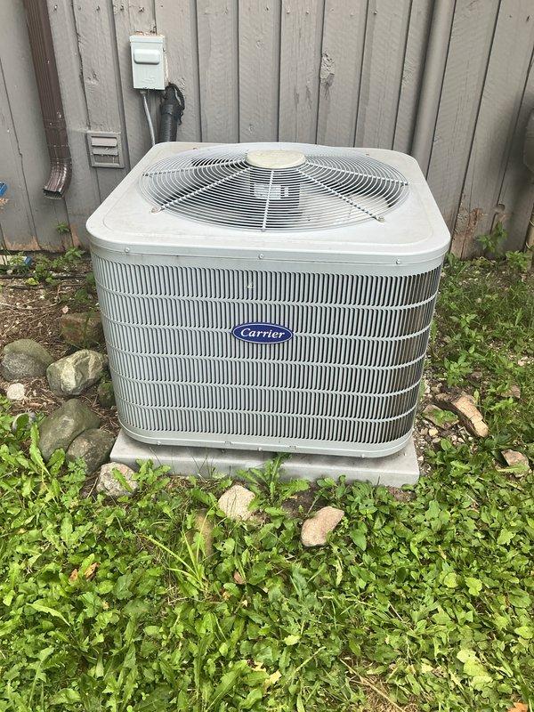 Completed comprehensive AC tune-up on 5-year-old Carrier central air conditioning system. Performed standard preventative maintenance procedures including filter inspection, refrigerant level check, electrical connection testing, condenser coil cleaning, and system performance verification. Unit operating within normal parameters with no deficiencies noted; customer advised system is in good working condition.