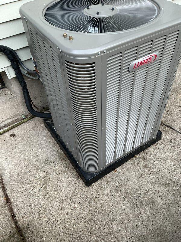 Performed annual cooling maintenance on residential Lennox condensing unit. Inspected condenser coil, fan assembly, and refrigerant lines; all components found in good operating condition with minimal wear and proper airflow. Unit operating within normal parameters with no deficiencies noted.