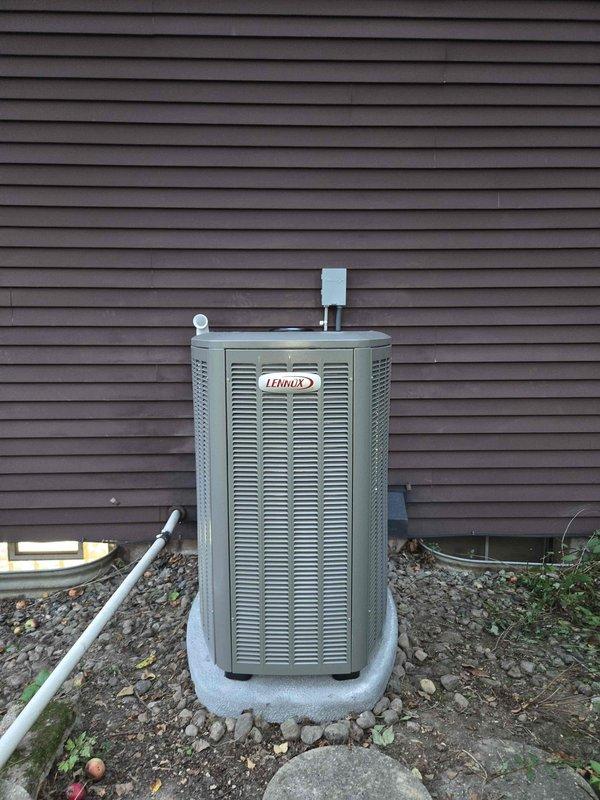 Completed full HVAC system installation including a 90,000 BTU furnace and 3-ton air conditioning unit in rear yard location. Installed Lennox outdoor condensing unit on concrete pad with proper clearances, ran refrigerant lines and electrical connections to building, mounted electrical disconnect box on exterior wall, and integrated humidifier into system. Secured all required mechanical and electrical permits prior to installation, established condensate drainage with PVC piping, and reconnected all utilities upon completion of work.