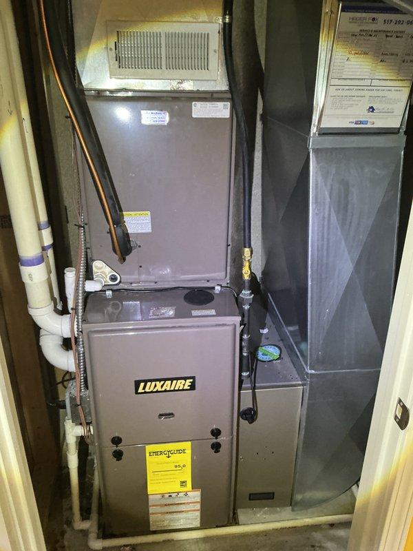 Completed annual cooling maintenance on Luxaire HVAC system. Performed comprehensive inspection of indoor furnace/air handler unit and outdoor condenser unit, verified proper operation of all components, checked refrigerant lines and PVC drainage system, and confirmed system is functioning within manufacturer specifications. Equipment found in good operating condition with normal wear patterns.