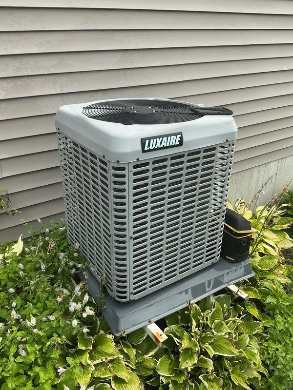 Completed annual cooling maintenance on Luxaire HVAC system. Performed comprehensive inspection of indoor furnace/air handler unit and outdoor condenser unit, verified proper operation of all components, checked refrigerant lines and PVC drainage system, and confirmed system is functioning within manufacturer specifications. Equipment found in good operating condition with normal wear patterns.