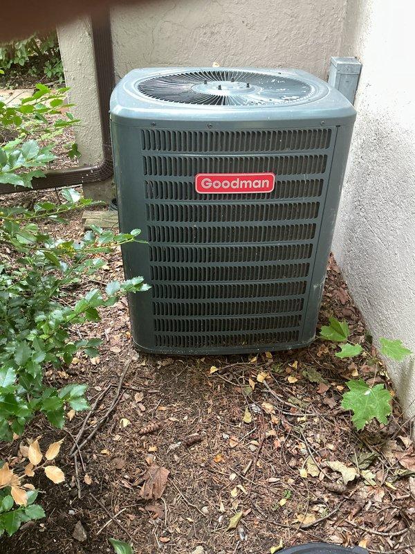 Completed annual cooling maintenance on Goodman outdoor condenser unit. Performed comprehensive system inspection including electrical connections, refrigerant levels, and component operation. Cleared vegetation and debris from around unit base and verified proper airflow through louvers and fan assembly. Confirmed electrical disconnect box secure and all safety controls functioning properly. Unit operating within normal parameters upon completion of preventative maintenance service.