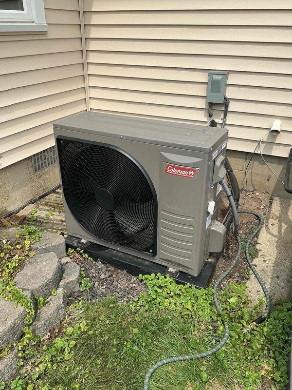 Completed annual preventative maintenance on Coleman brand residential air conditioning system. Performed comprehensive inspection of outdoor condensing unit including verification of proper fan operation, examination of refrigerant line connections, and assessment of electrical disconnect box. Cleaned condenser coil fins, checked refrigerant pressures, and verified proper drainage from condensate removal system. Inspected all safety labels and certifications for compliance. Unit operating within normal parameters with no immediate service concerns identified.