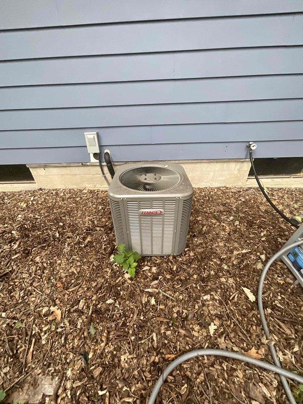Completed HVAC equipment assessment for replacement estimate on non-operational 6-year-old Lennox furnace and air conditioning system in basement installation. Natural gas furnace located in unfinished basement utility area with existing ductwork and venting infrastructure. Evaluated current Lennox outdoor condenser unit positioned on exterior of home with electrical disconnect and proper clearances. Documented existing equipment configuration including galvanized steel ductwork, PVC condensate drainage, and electrical connections to provide comprehensive replacement options for both heating and cooling systems.