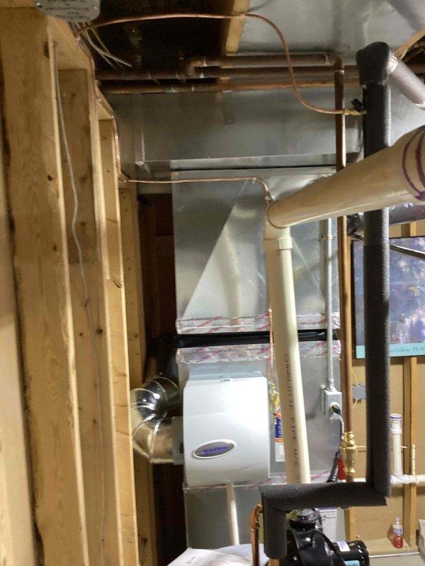 Completed full HVAC system installation including a 90,000 BTU high-efficiency furnace and 3-ton air conditioning unit with outdoor condenser located in rear yard. Installed AprilAire whole-home humidifier integrated into ductwork system with proper water supply and drain connections. Ran refrigerant lines using copper piping, installed metallic ductwork with proper insulation and sealing, and reconnected all necessary electrical and mechanical components to ensure complete system functionality.