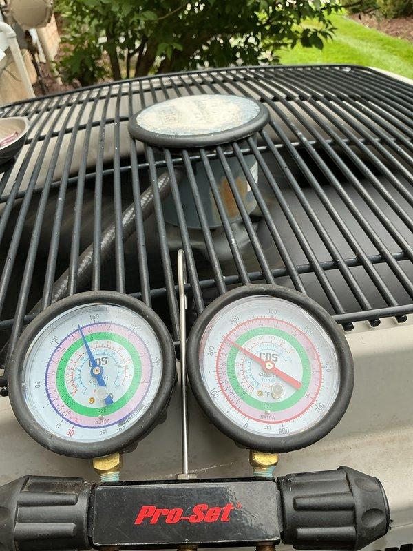 Completed spring maintenance on residential HVAC system including furnace inspection and air conditioning tune-up. Performed comprehensive AC diagnostics using manifold gauge set to measure refrigerant pressures and verify system operation on outdoor condensing unit. All equipment found operating within normal parameters with no issues identified during inspection.