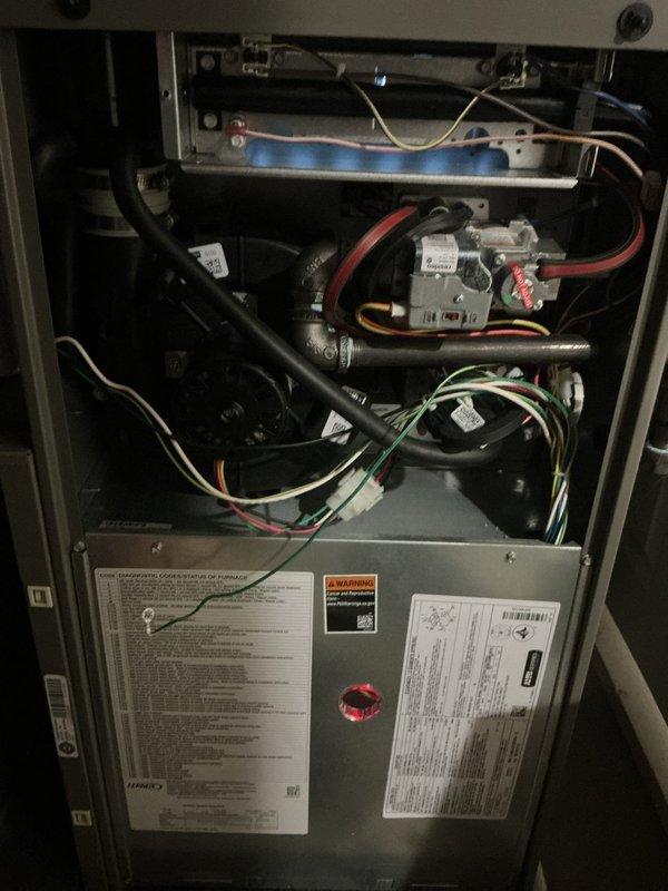 Completed comprehensive ComfortGuard Maintenance Package on 3-year-old HVAC system including air conditioning unit and furnace. Performed full AC tune-up with inspection of outdoor condenser unit, refrigerant line assessment per customer concern, and verified proper system operation with thermostat reading 68°F in cooling mode. Conducted furnace safety inspection with access panel removed, verified gas valve operation, pilot assembly function with visible blue flame, inspected blower compartment, electrical connections, and all internal mechanical components for proper operation and safety compliance.