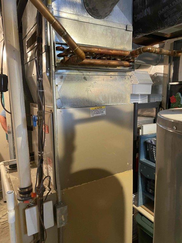 Completed comprehensive estimate for full HVAC system replacement at residential property. Evaluated existing 15-year-old Bryant air conditioning system experiencing complete cooling failure and continuous fan operation. Assessed current furnace and air handler configuration in basement mechanical room, documented equipment dimensions and clearances, photographed existing installation including ductwork connections, copper refrigerant lines, PVC condensate drainage, and electrical connections. Provided customer with detailed proposal for new furnace and air conditioning system to replace aging equipment.