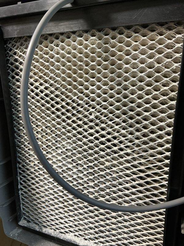 Completed annual heating and cooling maintenance on air handling unit. Inspected and documented heavily soiled air filter showing significant dust and debris accumulation throughout mesh surface, indicating extended service interval. Filter condition compromising airflow efficiency and system performance. Verified thermostat operation displaying 81°F current temperature with setpoint of 84°F and scheduled temperature change in 55 minutes. Performed standard preventive maintenance procedures including visual inspection of unit components, ductwork connections, and control systems to ensure proper operation for upcoming heating season.