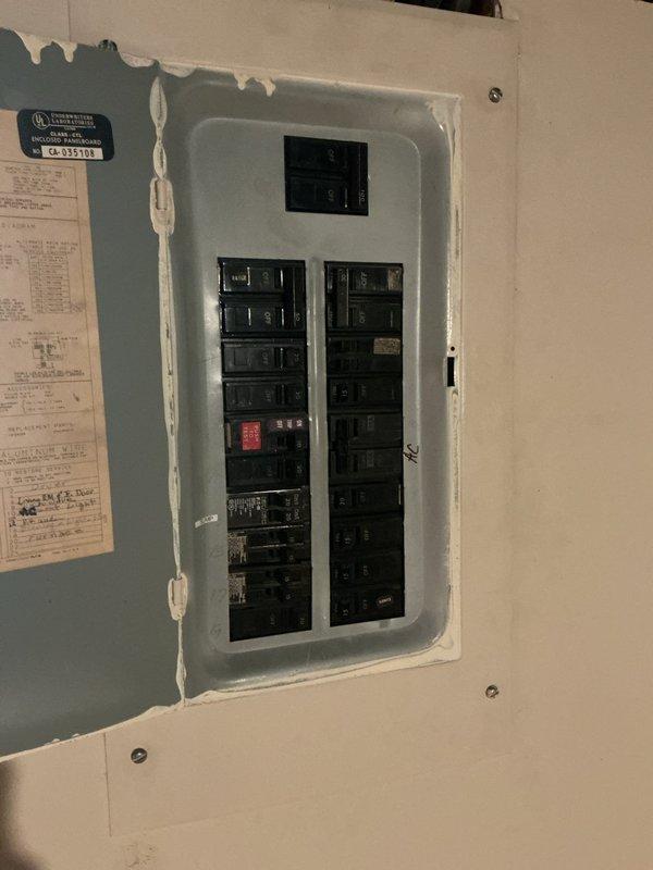 Completed comprehensive electrical panel upgrade estimate for residential property, including assessment of existing interior breaker panel and exterior meter enclosure. Evaluated current electrical infrastructure to determine requirements for main panel replacement and installation of dedicated sub-panel for air conditioning system. Documented existing panel configuration, weathered exterior meter housing with visible deterioration, and electrical service entrance conditions to provide accurate scope of work for complete system upgrade.