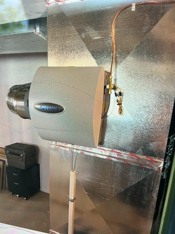 Installed a 17-gallon AprilAire bypass humidifier on existing HVAC ductwork system. Connected unit to supply and return ducts using metallic bypass ductwork, secured copper water supply line with brass fittings, and mounted humidifier to sheet metal plenum. Verified proper water flow, tested unit operation, and ensured all connections were secure and leak-free.