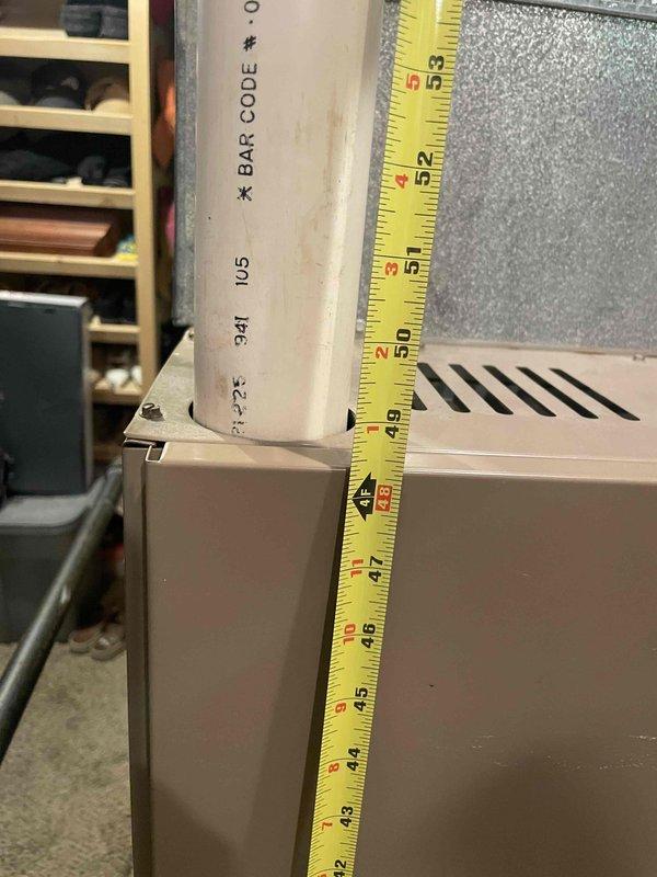 Provided comprehensive estimate for replacement of non-operational air conditioning system originally installed in 1995, located in basement utility room. Assessed existing HVAC equipment configuration, including furnace setup, ductwork measurements, and condensate drainage system with PVC piping. Documented equipment specifications, spatial constraints, and moisture conditions on concrete floor to determine appropriate replacement unit sizing and installation requirements.