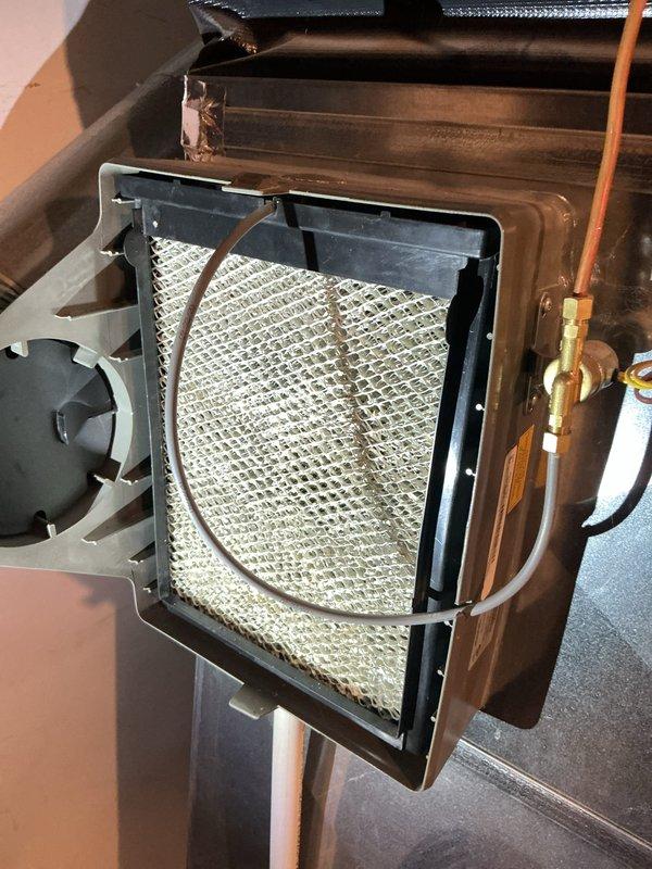 Completed complimentary ComfortGuard maintenance tune-up on five-year-old Lennox forced air furnace and air conditioning system. Performed comprehensive inspection of both units, including visual assessment of manufacturer specifications, electrical components, and refrigerant lines. Documented heavily soiled blower compartment filter requiring attention, with significant dust and debris accumulation affecting airflow efficiency. Inspected copper refrigerant lines, brass fittings, and blower motor assembly. Both systems confirmed operational at time of service.