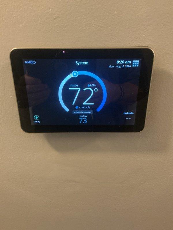 Completed ComfortGuard AC-only maintenance service during rescheduled appointment after previous visit was postponed due to inadequate ambient temperature conditions. Inspected cooling system components, replaced heavily contaminated air filter showing significant dust and debris accumulation, and verified Lennox thermostat operation displaying proper cooling mode function at 72°F setpoint.