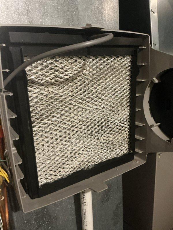Completed routine HVAC maintenance including AC tune-up and furnace inspection. Inspected air filter condition, finding clean mesh filter properly installed in housing. Verified all electrical connections, wiring, and ductwork at furnace unit. Checked gas line connections, blower motor assembly, and ventilation components. All systems operating within normal parameters with no issues identified. Equipment ready for continued service.