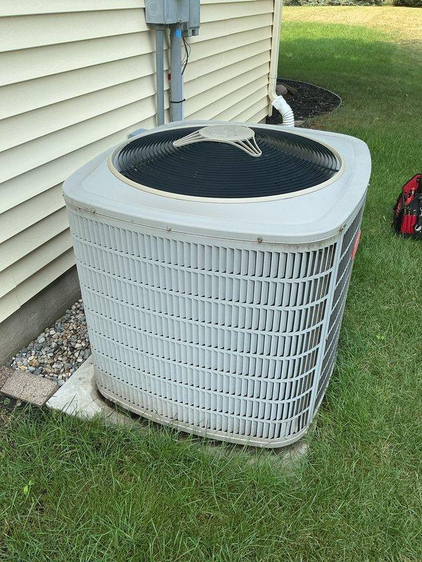 Completed annual maintenance on residential central air conditioning system. Performed comprehensive tune-up including inspection of outdoor condenser unit, verified electrical connections at disconnect box and conduit, checked refrigerant levels, cleaned condenser coils, inspected fan motor and blade operation, tested capacitor and contactor function, verified proper airflow through condenser grilles, and confirmed system operational status. Unit operating within normal parameters at time of service completion.