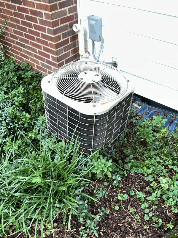 Completed annual cooling maintenance on residential HVAC system. Inspected outdoor condenser unit and indoor thermostat, replaced air filter, and verified proper system operation. All equipment found in good working condition with no issues identified.