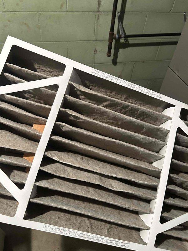 Completed routine Air Care Maintenance on residential HVAC system. Inspected outdoor condensing unit and found heavily soiled condenser coil with significant dirt and debris accumulation affecting airflow efficiency. Cleaned condenser coil and removed organic debris from base of unit. Replaced two dirty pleated air filters with accumulated dust and particulate matter. Verified proper system operation upon completion of maintenance tasks.