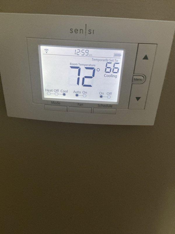 Performed routine maintenance on a one-year-old central air conditioning system operating without reported issues. Completed standard tune-up procedures including system inspection, verified proper thermostat operation showing 72°F cooling setpoint, and replaced air filters with new 20x25x4 units. All components functioning within normal parameters with no deficiencies noted.