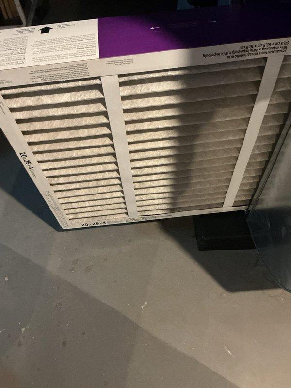 Performed routine maintenance on a one-year-old central air conditioning system operating without reported issues. Completed standard tune-up procedures including system inspection, verified proper thermostat operation showing 72°F cooling setpoint, and replaced air filters with new 20x25x4 units. All components functioning within normal parameters with no deficiencies noted.