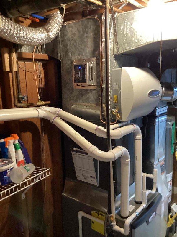 Completed installation of 90,000 BTU furnace unit in residential basement mechanical room. Installed new furnace with humidifier integration, established proper PVC condensate drainage system, and completed flue liner installation. All permits obtained, unit tested and operational, with all required documentation finalized.