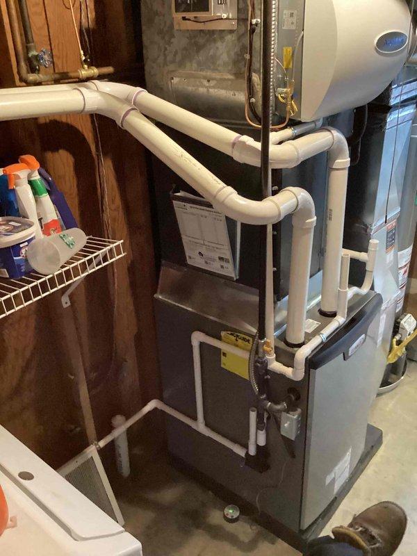 Completed installation of 90,000 BTU furnace unit in residential basement mechanical room. Installed new furnace with humidifier integration, established proper PVC condensate drainage system, and completed flue liner installation. All permits obtained, unit tested and operational, with all required documentation finalized.