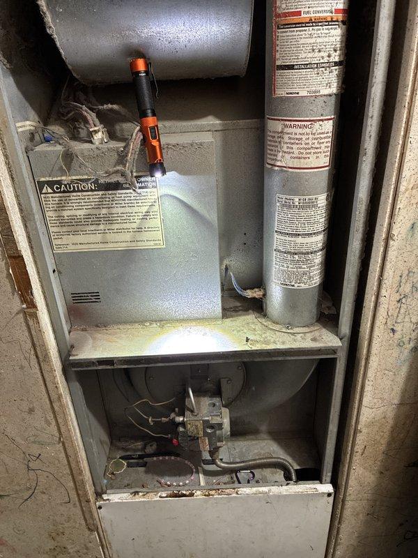 Conducted comprehensive assessment of existing HVAC system for full replacement estimate. Central air conditioning unit completely non-operational, and furnace producing excessive noise during operation with limited remaining service life. Inspected basement-mounted furnace installation, including blower assembly, internal components, and ductwork connections. Evaluated outdoor condensing unit condition and assessed electrical service panel capacity for new equipment installation. Documented existing equipment configuration and installation parameters through detailed photography to provide accurate replacement system specifications and installation requirements.