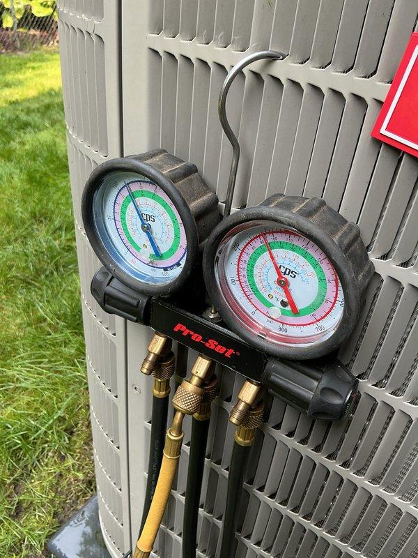Completed annual heating and cooling maintenance on outdoor HVAC unit. Performed system diagnostics using manifold gauge set to measure refrigerant pressures and verify proper system operation. All equipment tested and found operating within normal parameters.