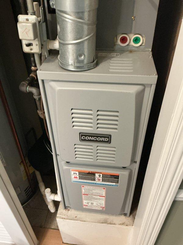 Performed routine furnace tune-up on Concord brand gas furnace with age unknown per homeowner request. Completed comprehensive inspection of furnace components including heat exchanger, burners, ignition system, blower assembly, and safety controls with all items found operating within normal parameters. Verified proper airflow through supply and return ductwork, checked filter condition, tested thermostat operation, and confirmed adequate combustion air supply and venting through PVC piping. Inspected electrical connections, disconnect switch, and control board functionality with no issues identified. Cleaned burner assembly and blower components as needed during service. Performed visual inspection of outdoor air conditioning condenser unit noting normal seasonal debris accumulation around base and on protective grilles but unit structurally sound and accessible for future service. All safety devices tested and confirmed operational including limit switches and flame sensor. System c