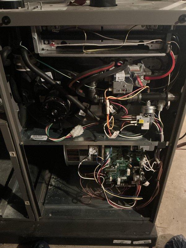 Completed comprehensive ComfortGuard Maintenance Package on four-year-old forced air furnace and air conditioning system. Performed complete AC tune-up including refrigerant level verification, condenser coil cleaning, and electrical connection inspection. Conducted thorough furnace inspection with access panel removal to examine gas valves, ignition assembly, blower motor, inducer fan assembly, and control board connections. Verified all wire harnesses and electrical connections were secure throughout both systems. Inspected heat exchanger components, burner assembly, and flame sensor. Tested system controls and thermostat operation for both heating and cooling modes. Cleaned blower compartment and replaced air filter. All components found operating within manufacturer specifications with no issues identified. Both heating and cooling systems tested successfully and left in proper working condition.