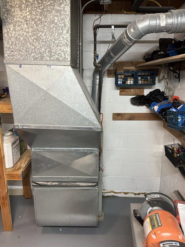 Provided comprehensive estimate for complete HVAC system replacement in basement location, including new furnace and air conditioning unit to replace existing 25+ year old equipment that is currently operational but has exceeded its expected service life. Assessed existing ductwork configuration, electrical connections, and installation requirements for proper sizing and equipment specifications.