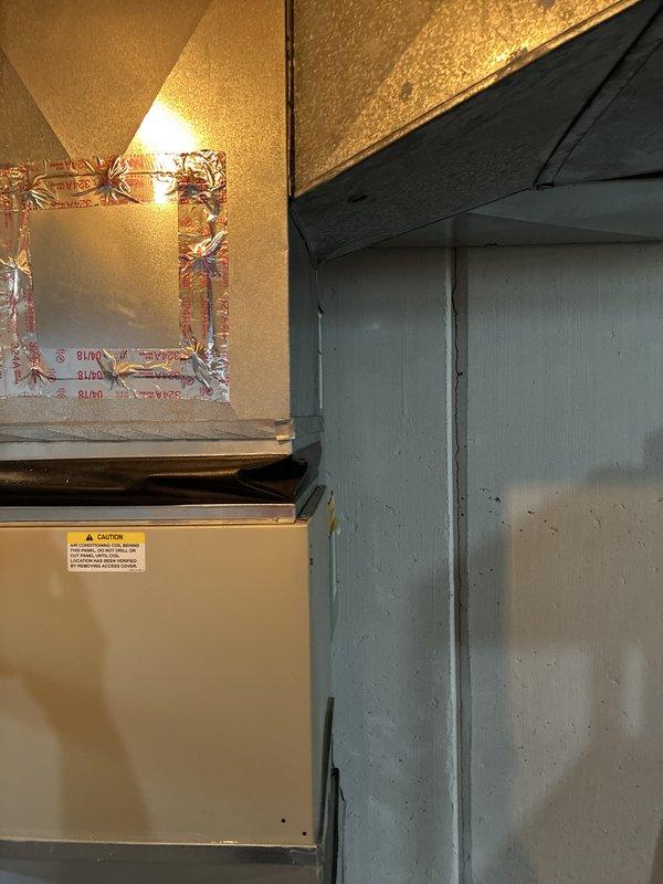 Provided replacement estimate for 30-year-old original air conditioning system and natural gas furnace located in basement. Inspected existing beige-colored furnace unit with connected ductwork and plenum system, documented current equipment configuration including flexible duct connections and galvanized steel ductwork. Current system operational at time of assessment.