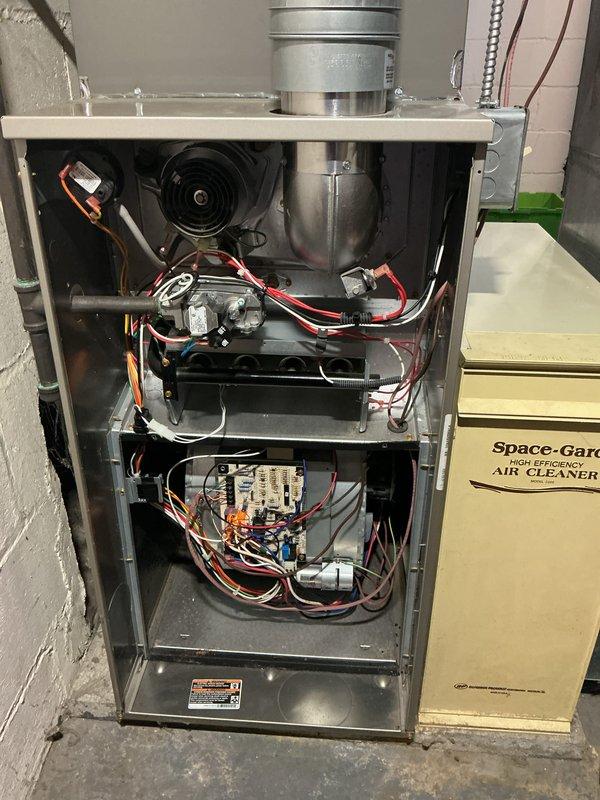 Completed routine maintenance service on 10-year-old residential forced air gas furnace system. Performed comprehensive inspection of all internal components including blower motor assembly, electrical connections, control boards, and wiring harnesses. Inspected and replaced air filter in Space-Gard air cleaner unit mounted adjacent to furnace. Verified proper operation of all electrical circuits, safety controls, and mechanical components. All systems tested and confirmed operating within manufacturer specifications. Unit left in good working condition.