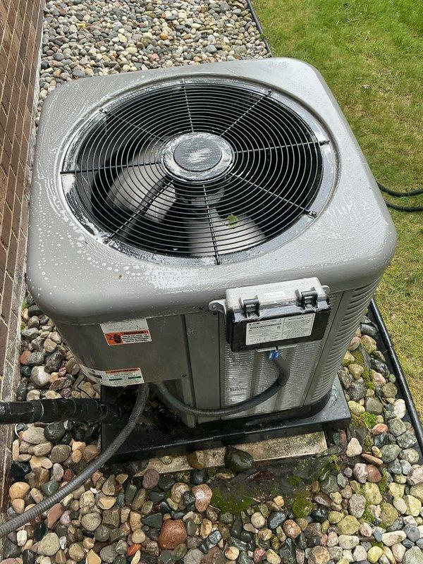 Completed comprehensive AC tune-up and maintenance on an 8-year-old Rheem system. Inspected and serviced both indoor air handler unit with air filter and outdoor condensing unit, verifying proper operation of all components. System confirmed operating correctly with no issues found; unit showing normal condensation and maintained in good working condition.