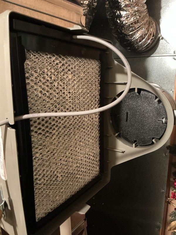 Performed comprehensive ComfortGuard Maintenance on central air conditioning system. Conducted complete AC tune-up including inspection of evaporator coil, air handler components, blower motor assembly, and control board connections. Verified all electrical connections, tested system operation, and documented equipment condition with photographs. System found operating properly with no deficiencies noted. All components including humidifier pad, ductwork connections, and condensate drainage inspected and confirmed in good working order.