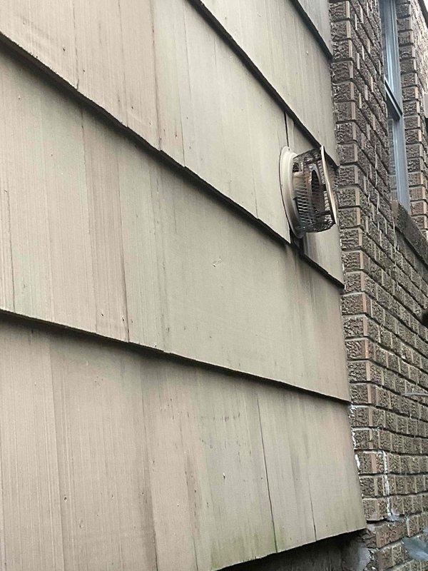 Conducted estimate for removal and replacement of 40-year-old gas-powered wall heater unit. Inspected existing installation mounted on exterior wall with venting through lap siding, documented current configuration and access conditions. Assessed narrow clearance area between structures with overgrown vegetation that will require consideration during removal and replacement process.