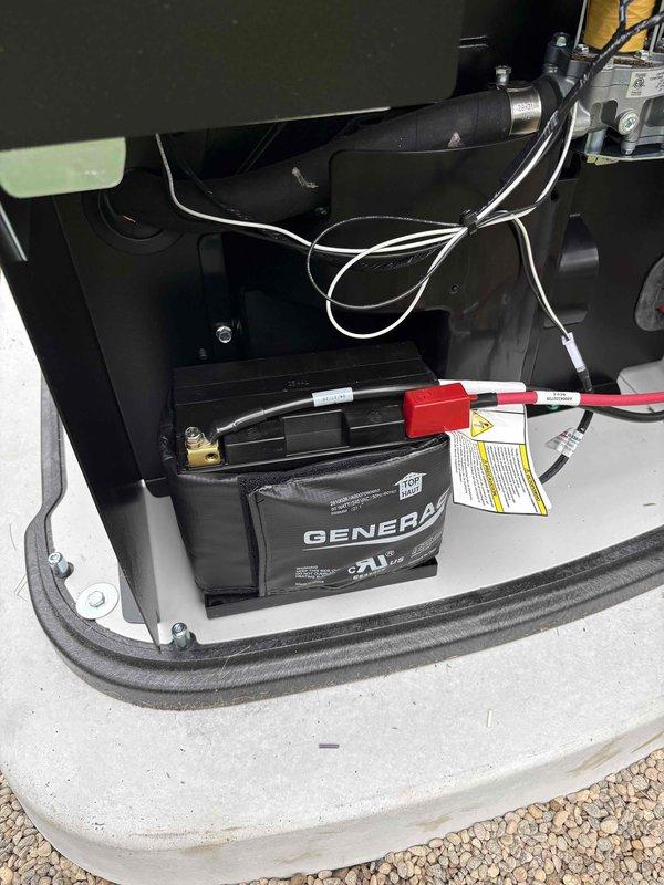Completed installation of 18kW Generac residential backup generator system on concrete pad adjacent to home exterior. Installation included gas line connection with pressure testing, transfer switch integration with existing 200-amp electrical service, battery installation with proper terminal connections, and conduit runs from main panel to generator unit. All mechanical and electrical permits obtained and work performed to code specifications.